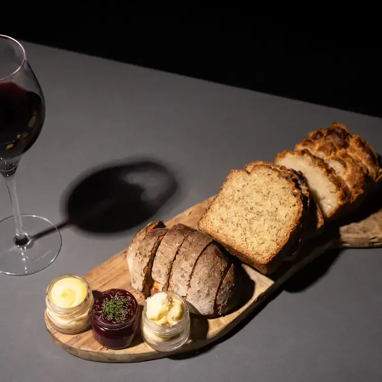 A board of sliced bread with butter and dips at Cellar 22 in Dublin