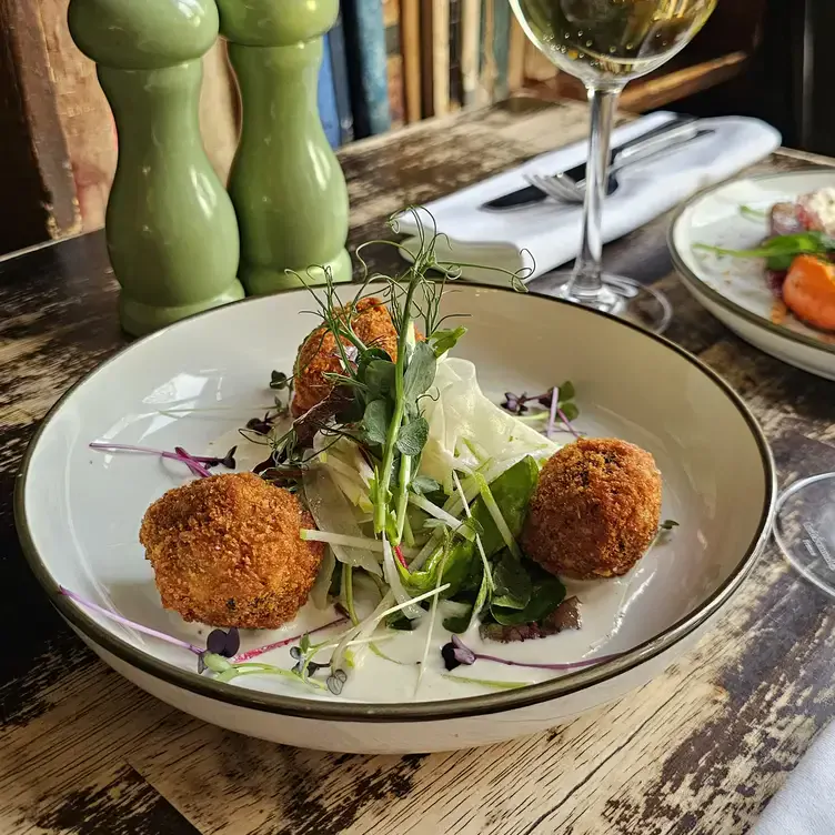 A fried dish served alongside a salad at The Winding Stair, one of Dublin’s best romantic restaurants