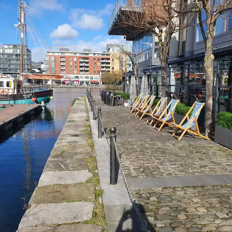 The outdoor space over the Grand Canal Dock at Charlottes Quay, one of the best local restaurants in Dublin.