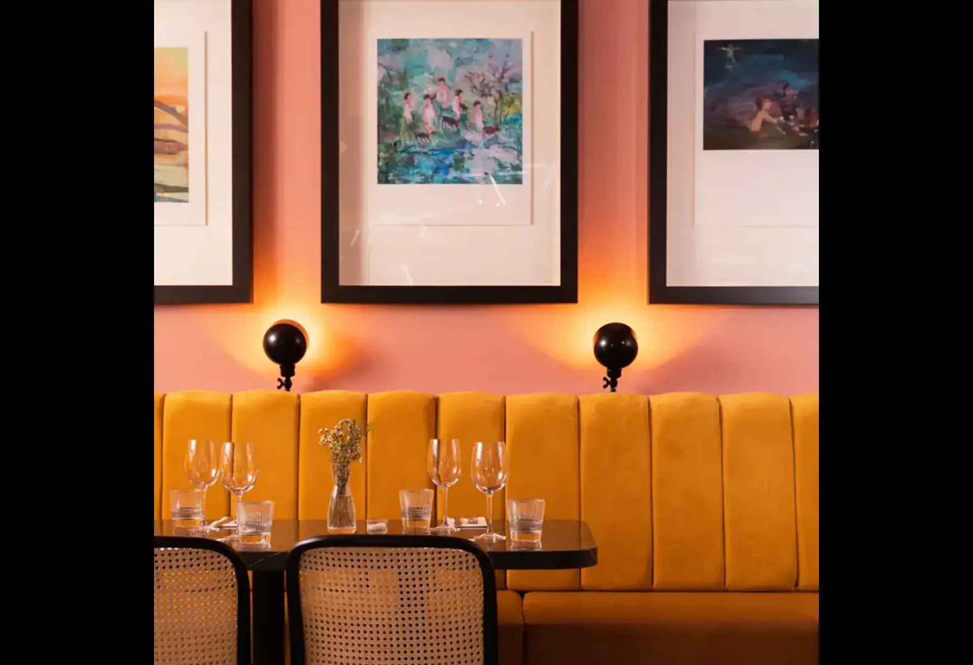 A wall table set with glasses at Lottie's, one of the best restaurants in Dublin.