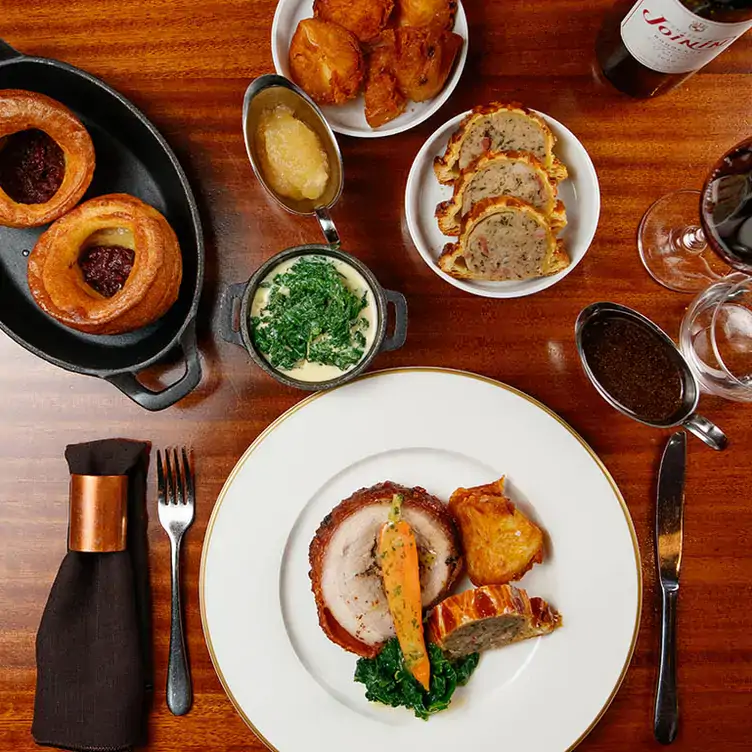 A pork roast with trimmings at Fade Street Social - The Main Restaurant, one of the best Sunday roasts in Dublin.