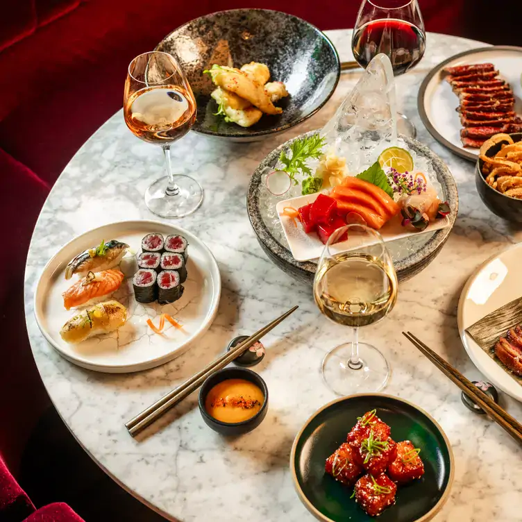 A spread of seafood dishes and wine at Floritz, one of the best sushi restaurants in Dublin.